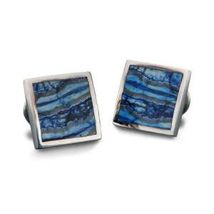 Front view of William Henry Blue Mammoth cufflinks showcasing blue fossil inlays and square sterling frames on white background