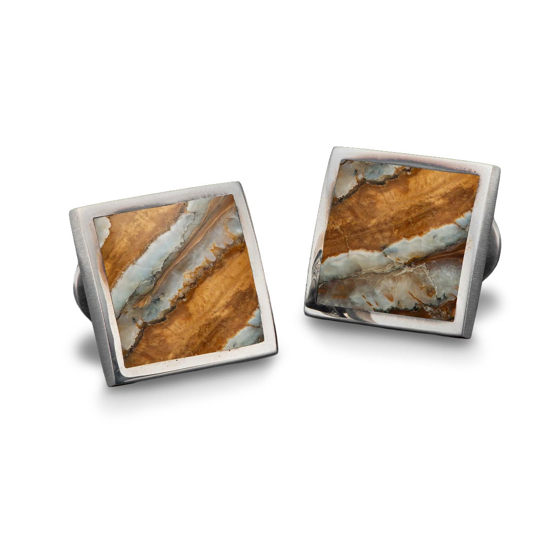 Front view of William Henry Brown Mammoth cufflinks with square sterling settings and brown fossil inlay on white