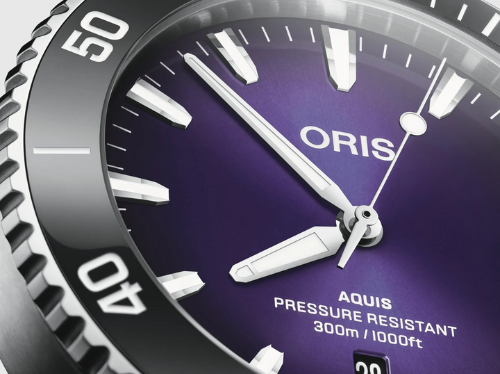 Oris watch with purple face and silver bezel