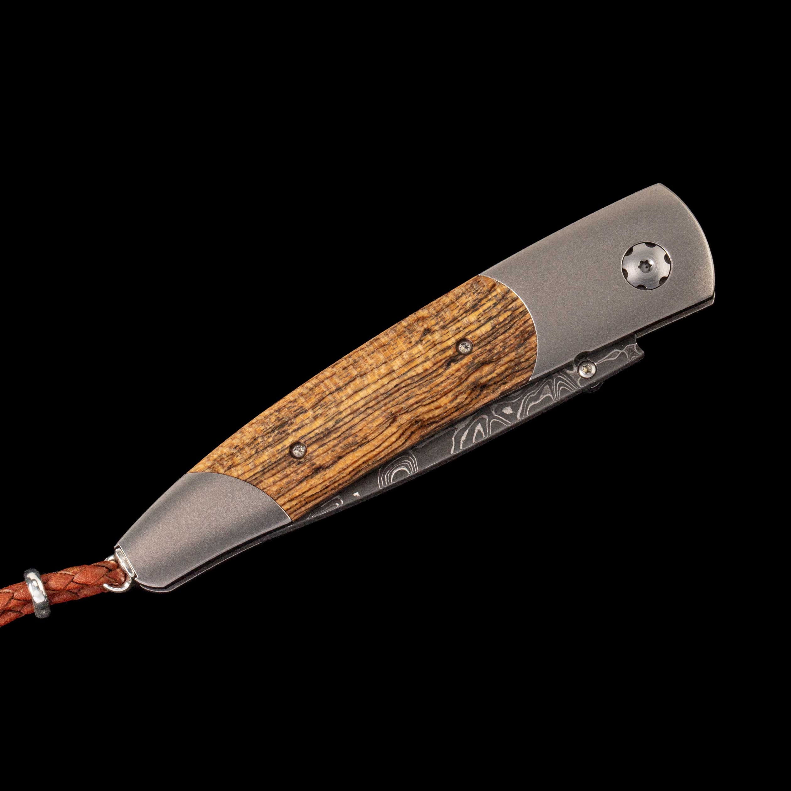 William Henry Fresh folding knife with wood handle inlay and Damascus blade, braided leather lanyard