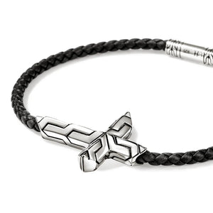 Bracelet with black braided cord and silver geometric clasp on a white background