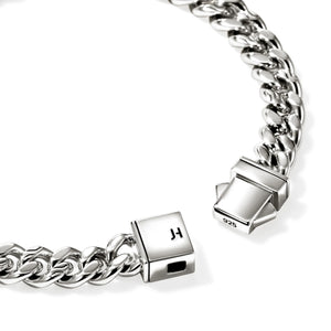 sterling silver bracelet with intricate clasp on a white background