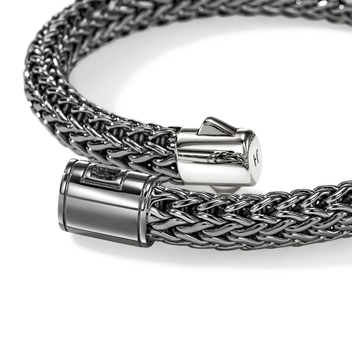close up of an open bracelet clasp on a white background