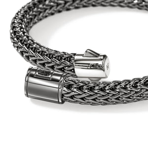 close up of an open bracelet clasp on a white background
