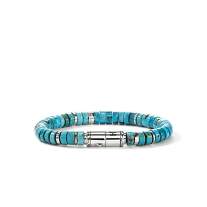 Turquoise beaded bracelet with silver clasp on a white background