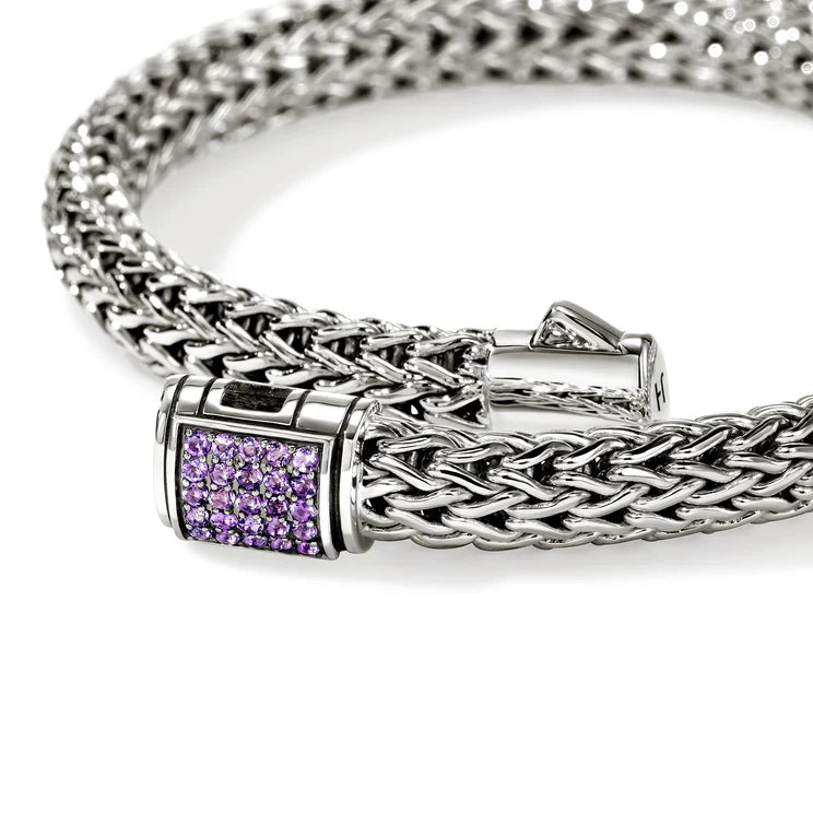 Silver bracelet with amethyst gemstones clasp on a white background