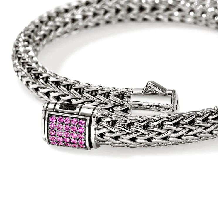Silver chain bracelet with a pink sapphires clasp on a white background