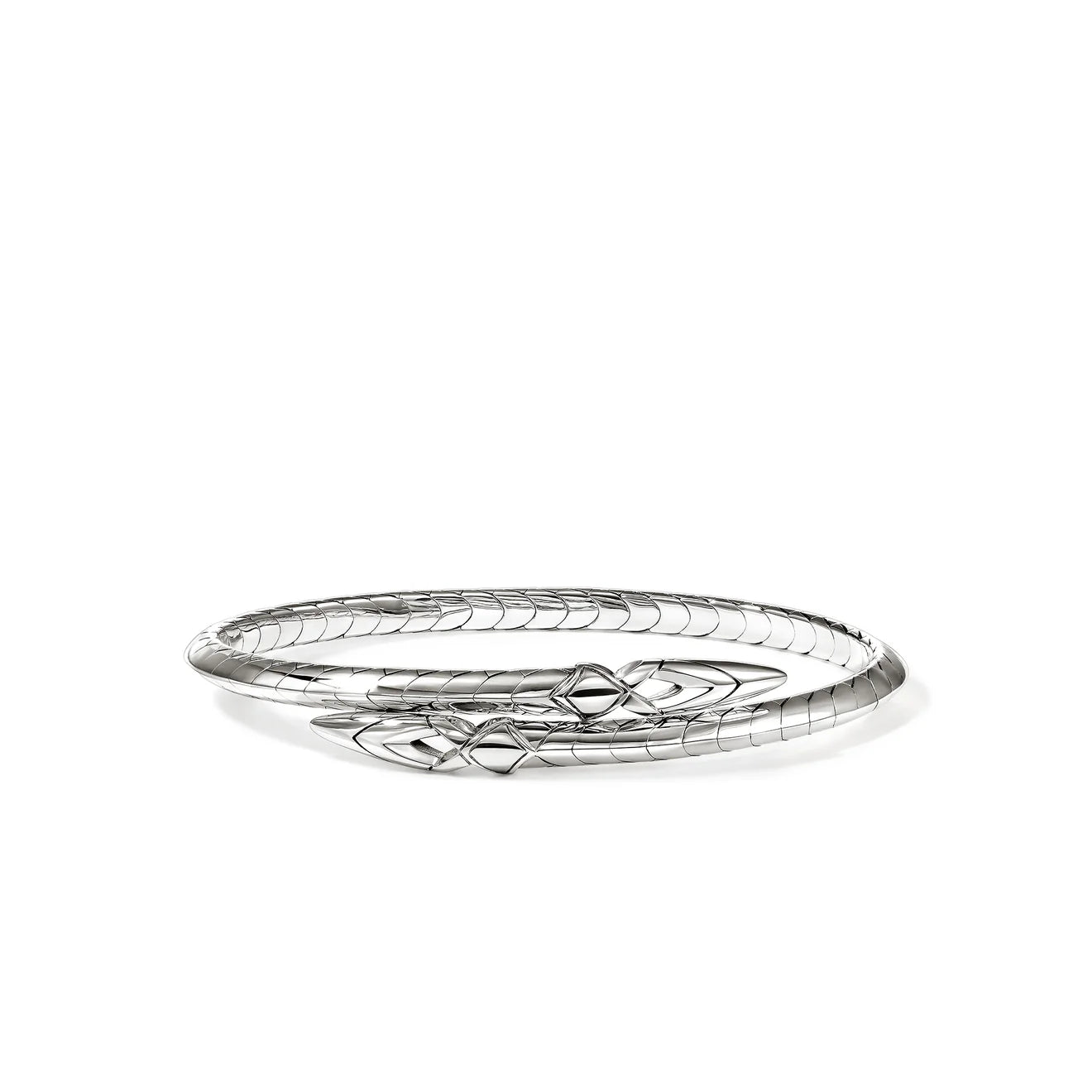 Silver bracelet with intricate design on a white background