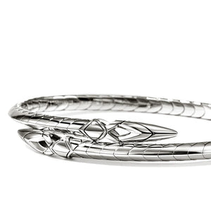 Silver bracelet with intricate design on a white background