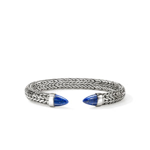 Silver bracelet with blue accents on a white background