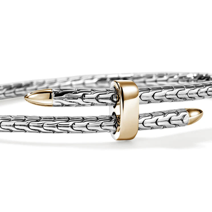 Silver and gold bracelet on a white background