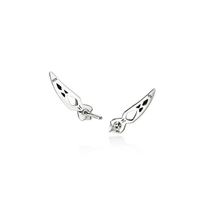 A pair of silver stud earrings with black engraved details, displayed on a clean white background.