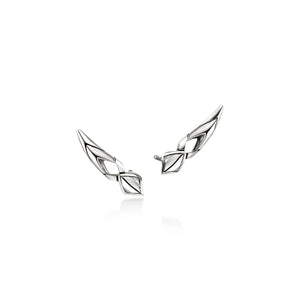 A pair of silver-toned geometric stud earrings with a polished, angular design, displayed on a clean white background with a soft reflection.