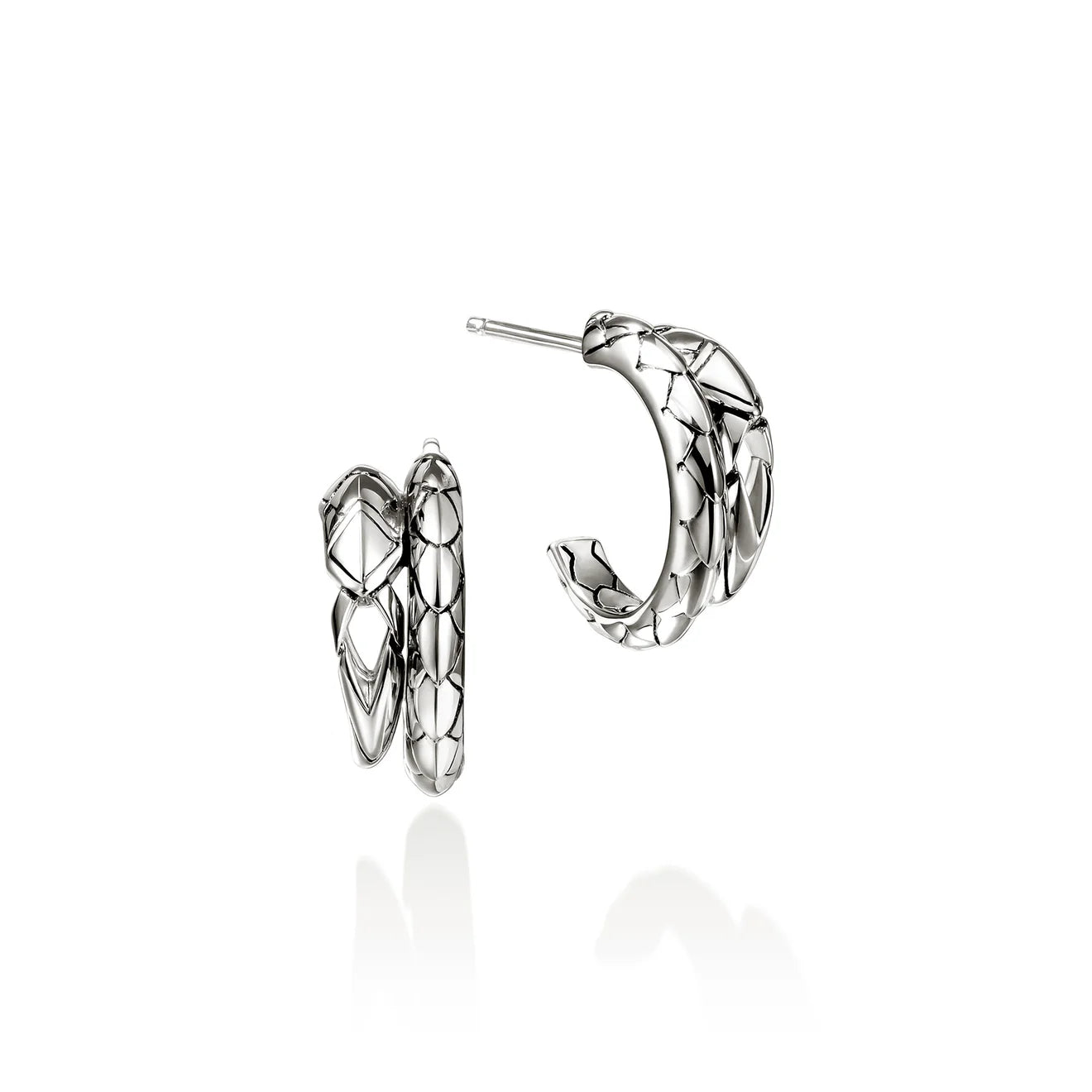 Pair of silver hoop earrings on a white background