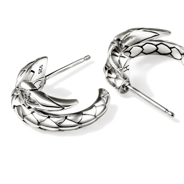Pair of silver hoop earrings on a white background