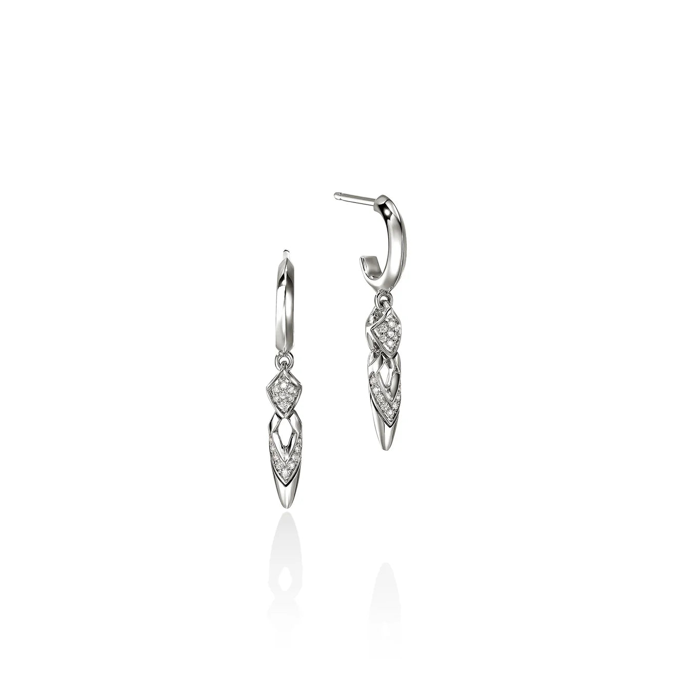 A pair of silver huggie hoop earrings with dangling leaf-shaped charms paved with diamonds, shown on a clean white background with a soft reflection below.