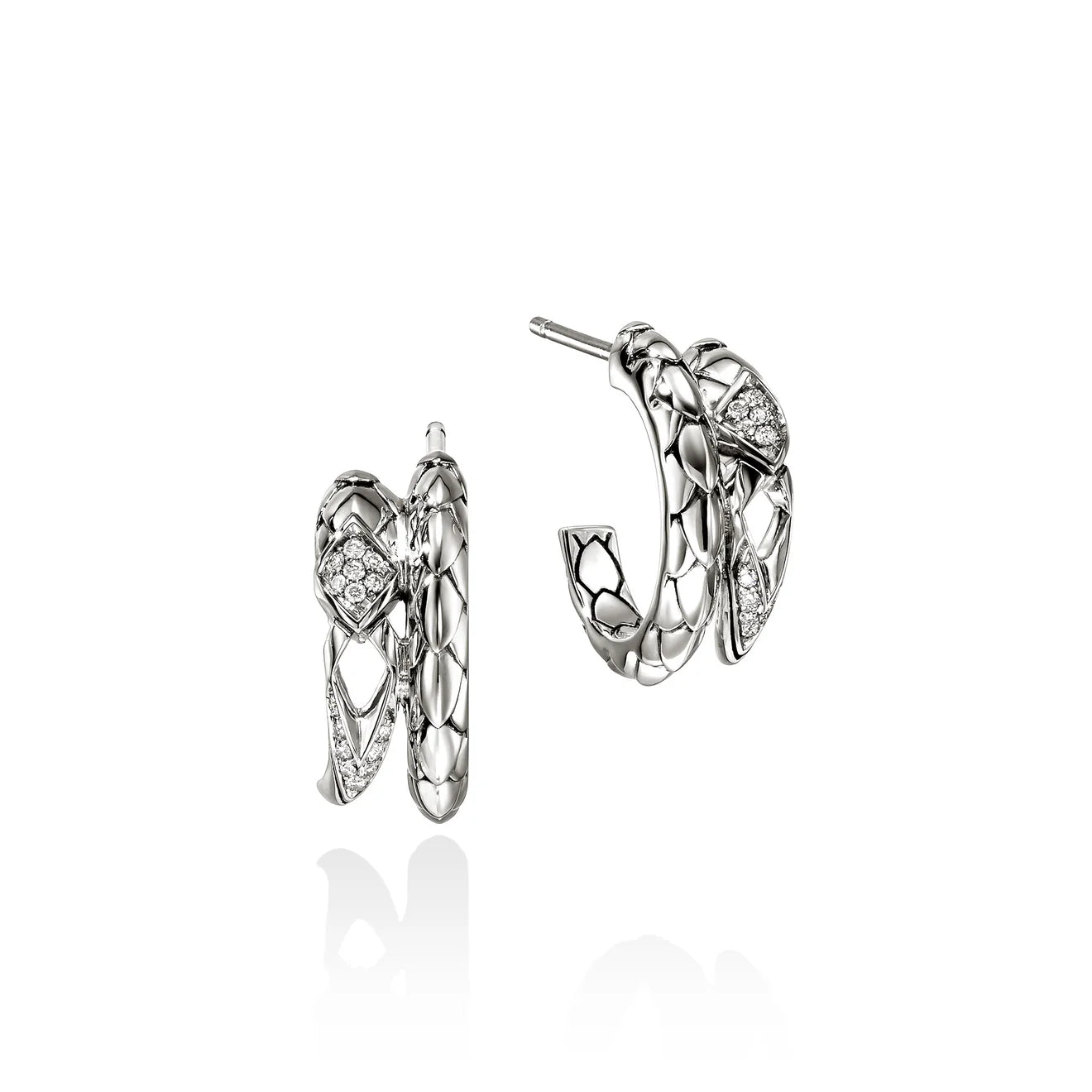 Pair of silver hoop earrings with heart-shaped designs on a white background