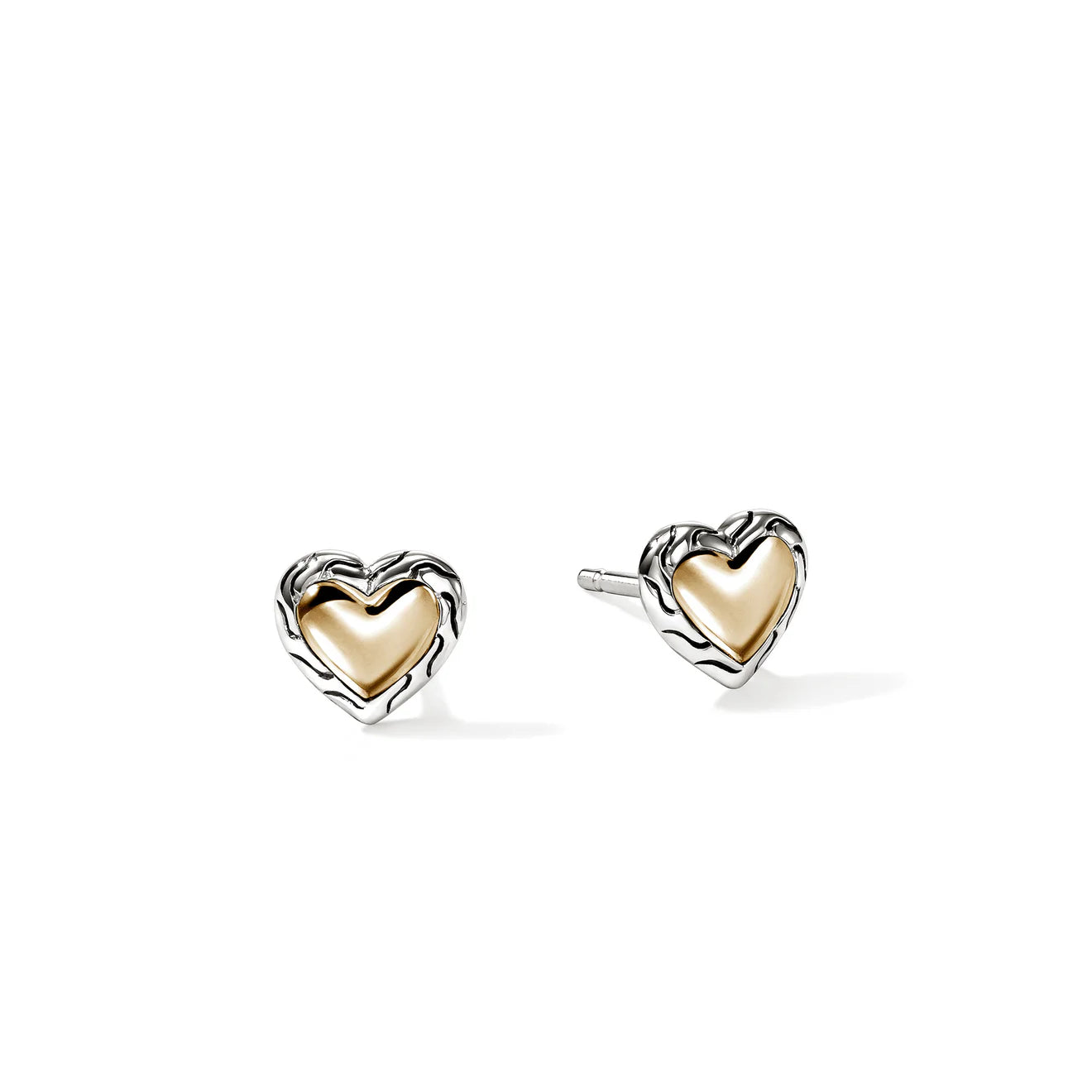 Heart-shaped gold earrings on a white background