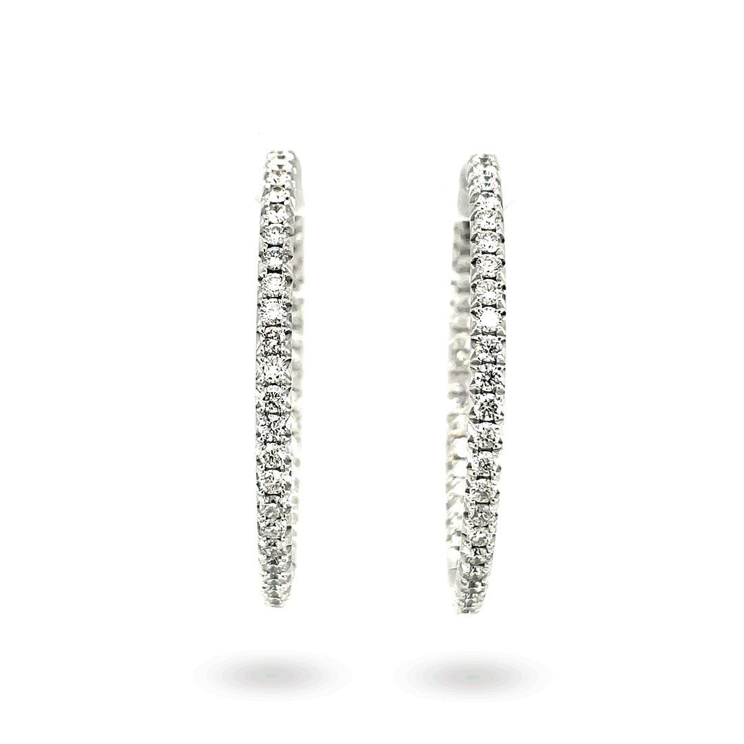 Front view of 14K white gold hoop earrings showing pave-set diamonds (3.03 ctw) on a white background