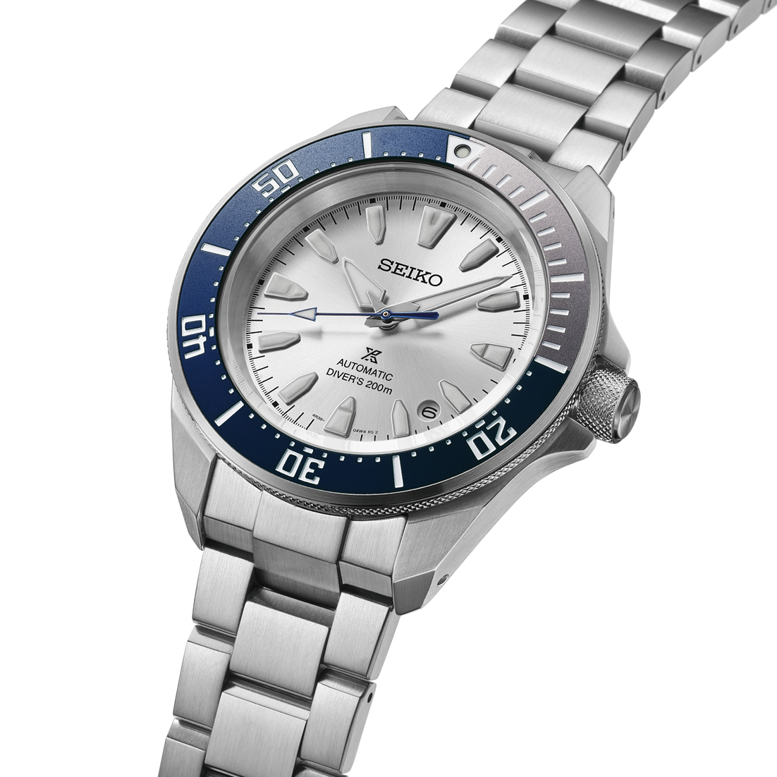 Seiko watch with silver bracelet and blue bezel on a white background