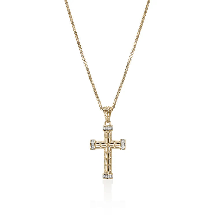 A gold cross pendant necklace with small clear gemstones set at the ends of each arm and on the bail, hanging from a delicate gold chain against a white background.