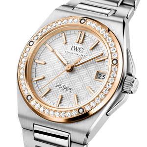 Close-up of IWC Ingenieur Automatic 35 watch with diamond-set rose-gold bezel and stainless steel bracelet on white