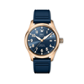IWC watch with blue strap and blue dial with gold bezel on a white background