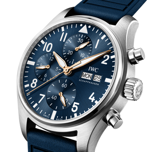 Luxury watch with blue strap and blue dial on a white background