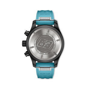 Caseback of pilot's watch engraved 63, ring text 10 BAR • IWC • PILOT'S WATCH, turquoise strap stamped SWISS MADE