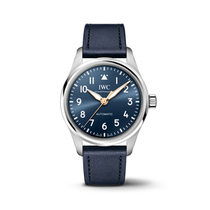 Front view of IWC Pilot's Watch Automatic 36 Le Petit Prince with blue sunburst dial, gold hands, stainless steel case and blue calfskin strap on black background