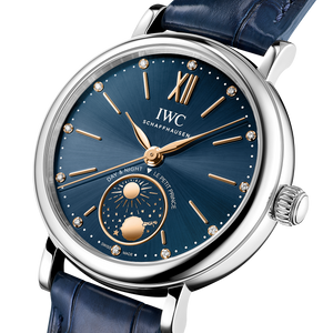 IWC watch with blue strap and blue dial on a white background