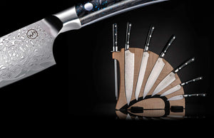 Close up of Kultro Pro knife set on maple display showcasing Damascus pattern blades and black riveted handles on black background