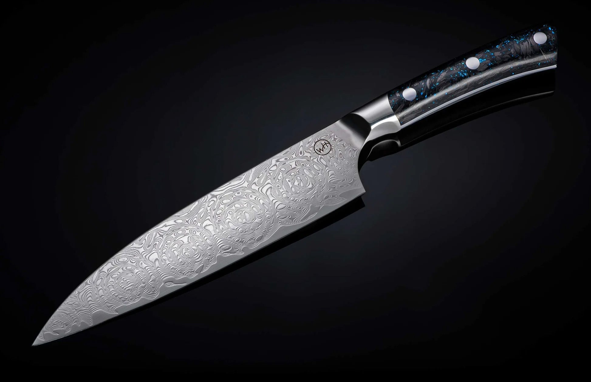Angled view of Kultro Pro chef knife showcasing Damascus-patterned blade and maple handle on dark gradient background