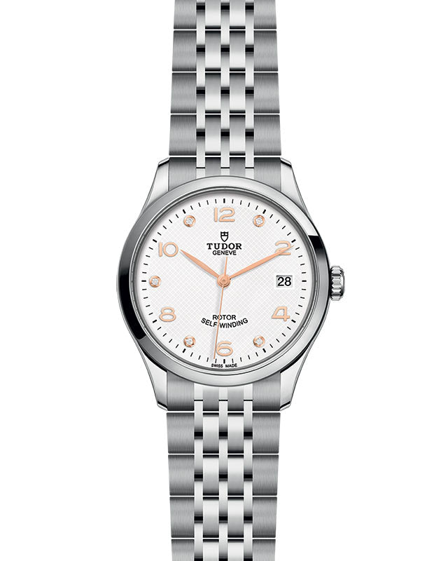 Front view of Tudor 1926 36mm stainless steel watch with white embossed dial, gold hands, diamond hour markers, date at 3