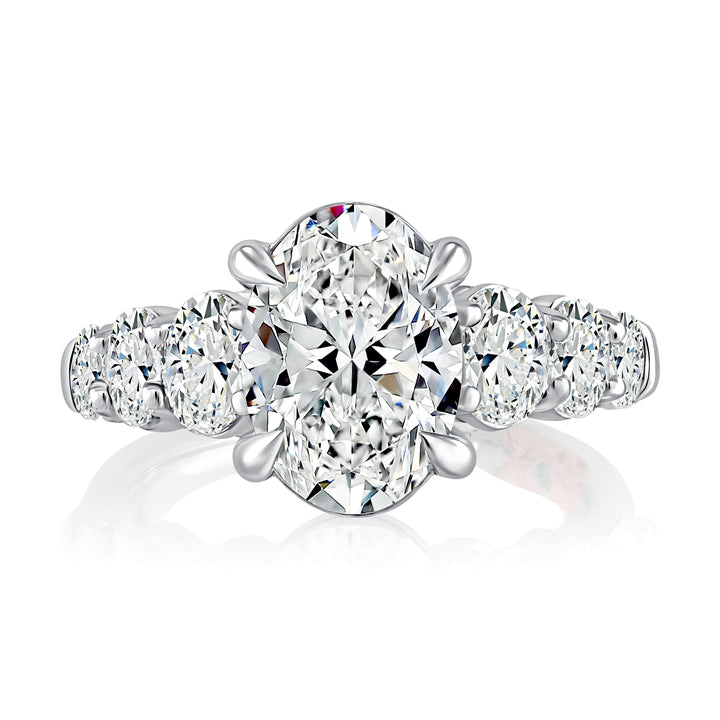 Classic Four Prong Oval Cut Diamond Flanked Engagement Ring