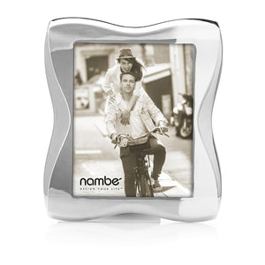 Silver wavy 8x10 Bella photo frame holding sepia couple on bicycle; nambe logo and DESIGN YOUR LIFE™ visible