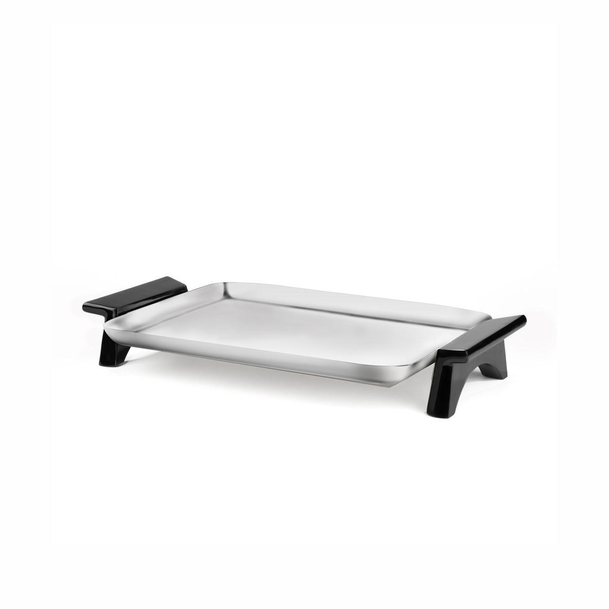 Three-quarter view of Circa rectangular tray showcasing brushed stainless steel surface and black angled handles on white background
