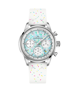 Front view of NORQAIN Freedom Chrono Sprinkles watch with mint-blue dial and white rubber strap with colorful sprinkles