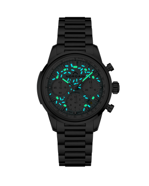 Front view of Norqain Freedom Chrono Sprinkles watch showing blue-green lume on a dark background