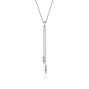 A silver-toned lariat necklace with a delicate chain, a small heart-shaped connector, and two dangling feather-like charms, shown on a plain white background.