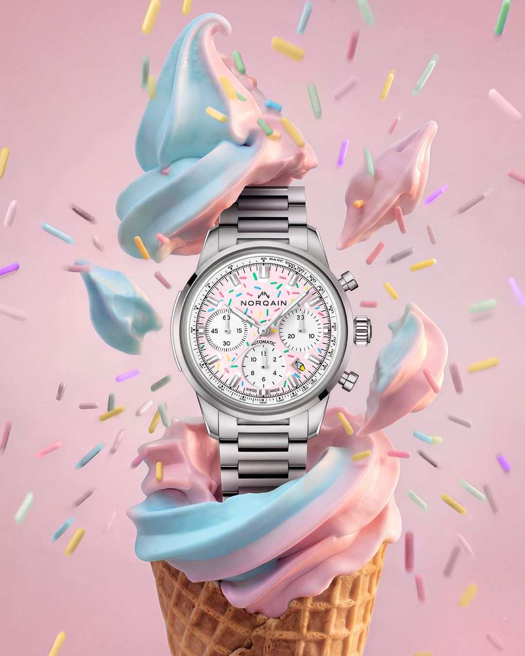 Silver watch on a colorful ice cream cone with sprinkles on a pink background
