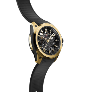 Three-quarter view of Wild ONE Skeleton 39mm yellow gold watch showing skeleton dial and black rubber strap on white background