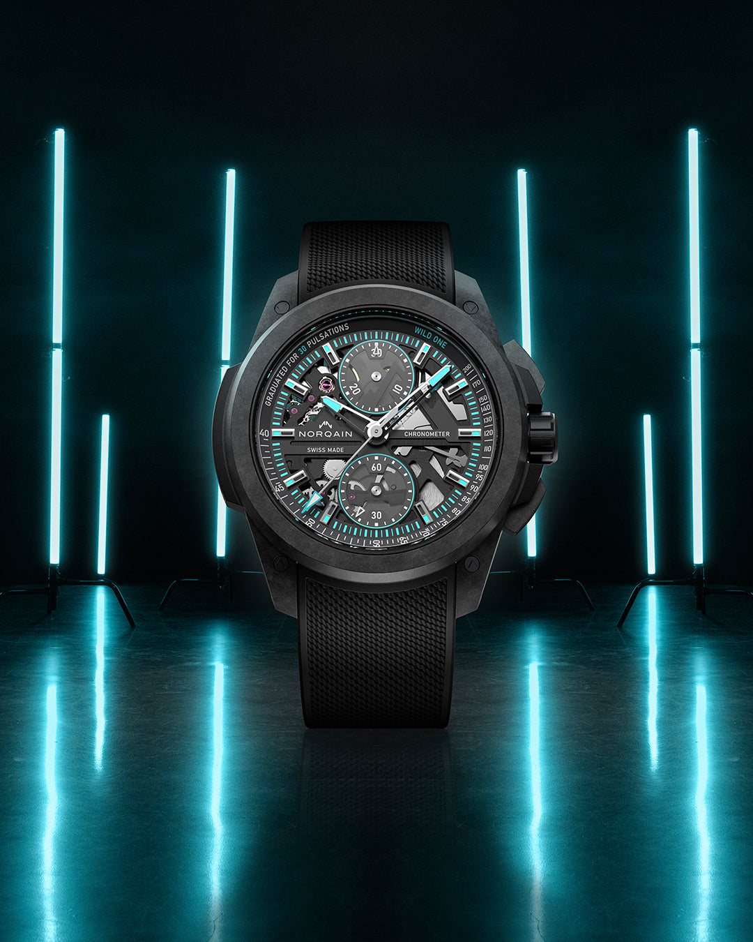 Black wristwatch with detailed face on a reflective surface with blue lights in the background
