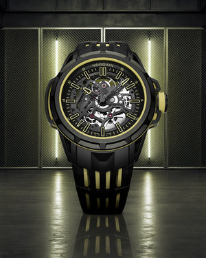Black and gold watch with mechanical components on a reflective surface and metallic background