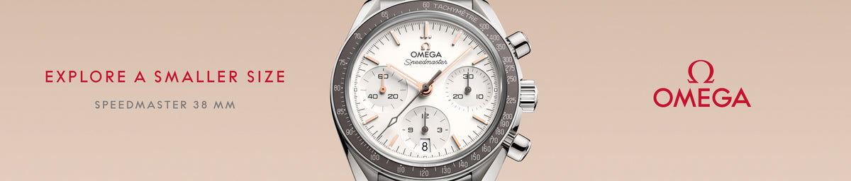 Omega Speedmaster watch with brand logos on a beige background