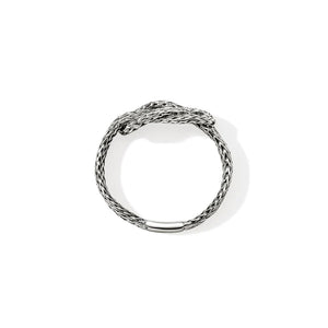 Silver ring with braided design on a white background