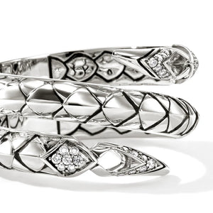 Silver snake-shaped ring with diamond accents on a white background