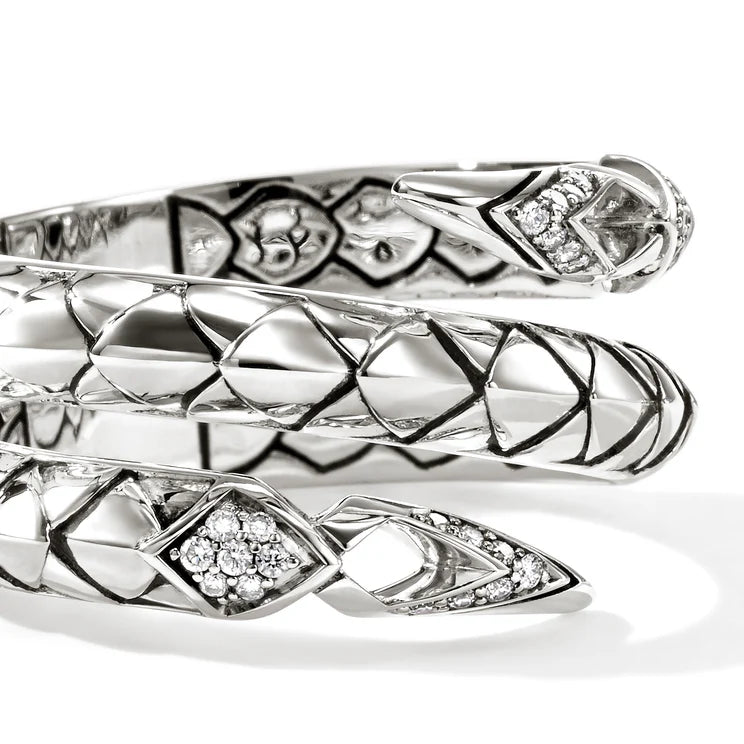 Silver snake-shaped ring with diamond accents on a white background