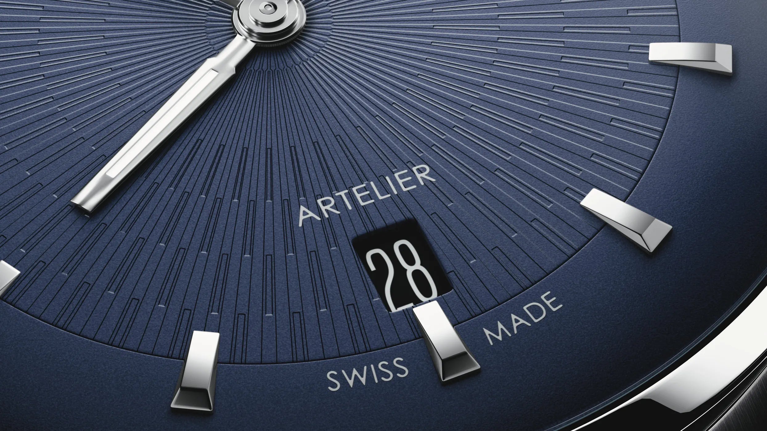 Close-up of a watch face with 'Artelier' branding and Swiss Made text.