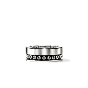 Silver ring with studs on a white background